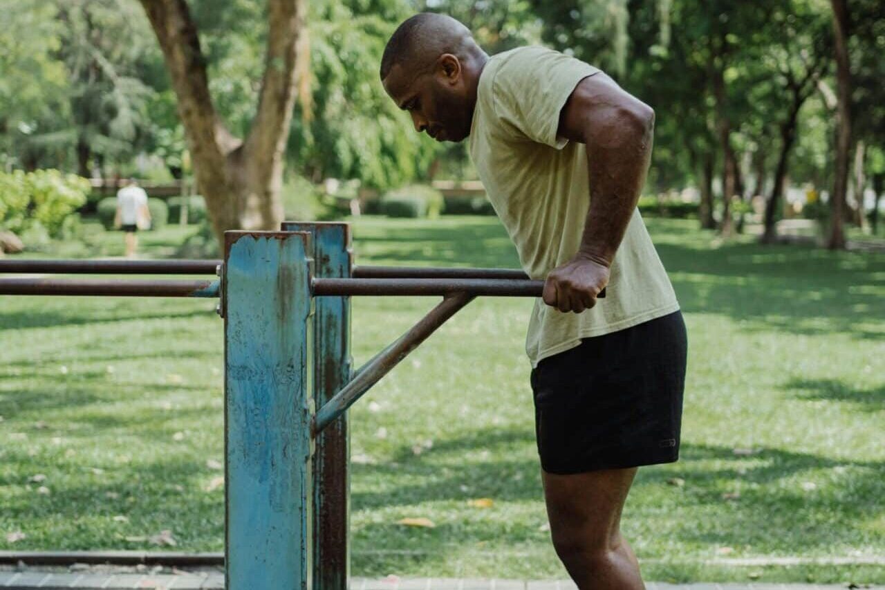 Man using outdoor gym. Photo: Pexels
